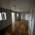 Large open-plan office container providing flexible workspace for management offices, meeting areas and administrative operations.
