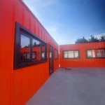 Construction site office containers arranged in a modular layout to provide efficient office space for project management teams.